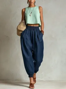 Vue détaillée de pantalon harem en lin pour femme avec taille élastique et revers stylés.