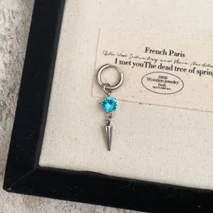 Exquisite spike pendant ear cuff featuring a stunning blue rhinestone for a bold and stylish look.