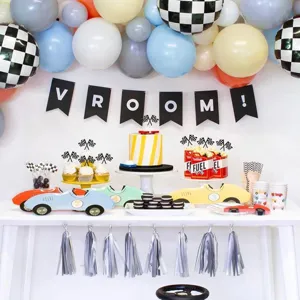 Racing theme party decoration set with checkered flags cupcake toppers and birthday party supplies.