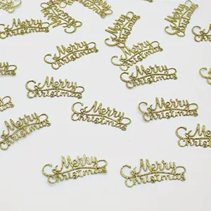 Gold Merry Christmas confetti paper pieces for holiday party table decoration and festive events.
