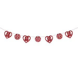 Close-up detail of the red glitter hanging garland with double happiness wedding decorations.