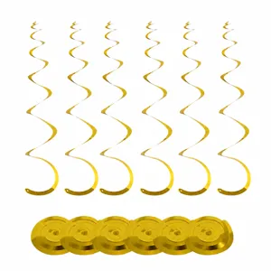 Gold spiral hanging swirls detail view, glossy party ceiling decor elements close up.