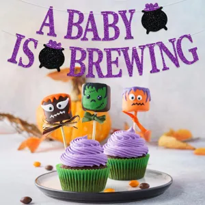 Halloween baby shower banner with glitter letters for spooky party decorations and cute themes.