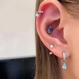 Exquisite multi-piercing earring set featuring stunning colorful crystal drops and sparkling diamonds.