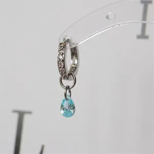 Exquisite crystal hoop earrings with light blue teardrop charm, chic minimalist jewelry trend.