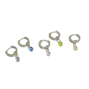 Detailed view of trendy colorful teardrop crystal pavé hoop earrings, delicate and stylish.