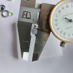 Detailed measurement view of exquisite teardrop zircon hoop earring with precise caliper.