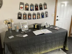 Kindergarten to 12th grade graduation photo banner detail showing classroom party decoration setup.