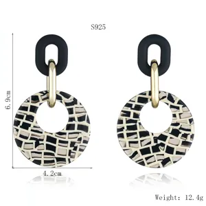 Detail view of geometric acrylic patterned drop earrings with S925 silver pin and chic design.