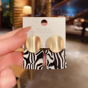 Chic matte gold and black white zebra pattern acrylic drop earrings with 925 silver post.