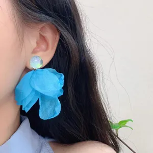 Elegant blue fabric flower earrings for women, resort style lightweight luxury chic jewelry design.