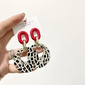 Korean style statement acrylic geometric leopard print circle earrings with silver needle.