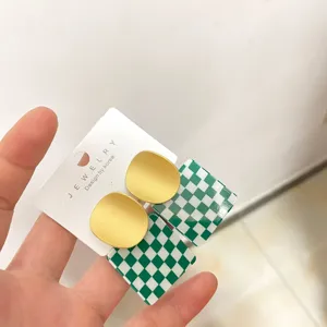 Green checkered acrylic and matte gold statement earrings for women fashion jewelry.