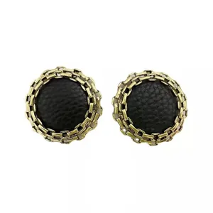 Vintage round geometric earrings featuring a black leather center and gold chain link border.