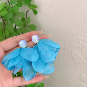 Blue fabric flower earrings with sparkling studs, elegant vacation style and chic design.