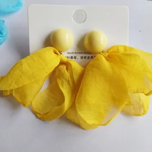Yellow chiffon petal drop earrings with round stud design, elegant fashion jewelry accessory.