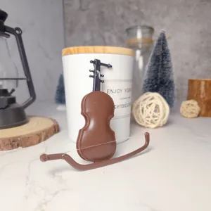 Miniature violin model dollhouse toy, tiny musical instrument for micro landscape.