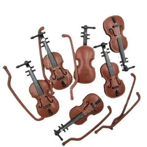 Detailed view of miniature dollhouse violin models and bows, perfect for DIY miniature scenes.