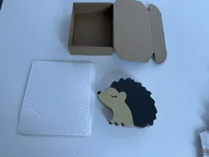 Wooden hedgehog piggy bank detail view, solid wood coin cash box for kids and room decor.