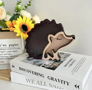 Close-up view of the cute wooden hedgehog piggy bank showing fine craftsmanship and details.