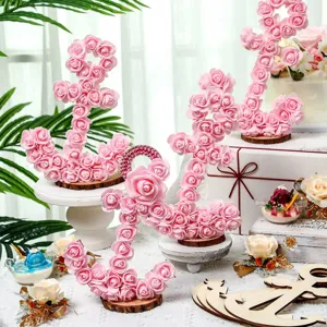Pink rose nautical anchor decorations and unfinished wood blanks for DIY party crafts.