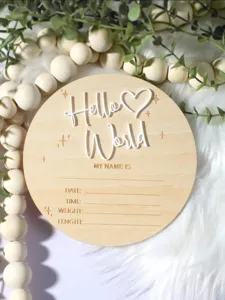 Wooden newborn milestone announcement board with Hello World text and birth stats for baby.