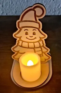 Detail view of the wooden angel candle holder ornament featuring an LED candle for tabletop decor.