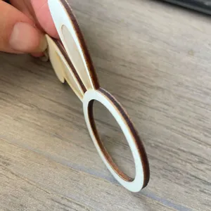 Wooden rabbit ear napkin ring detail showing clean laser cut edge and nice wood texture.