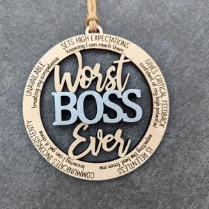 Close-up of wooden hanging ornament detail, laser engraved typography design, textured back.