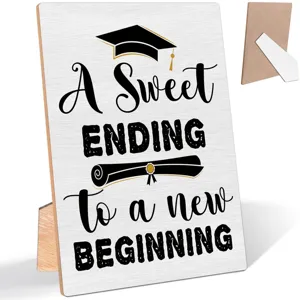 Wooden graduation plaque detail view with engraved lettering and desktop stand support.