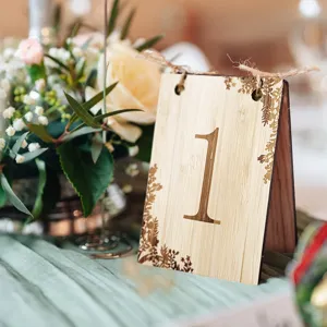 Wooden table number card for wedding decor, rustic wooden sign with engraved number one detail.