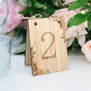 Wooden table number sign detail, rustic wedding decor place card with engraved number.