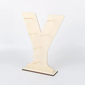 Wooden Y-shaped dessert display stand detail, showing pegs and base structure for party use.