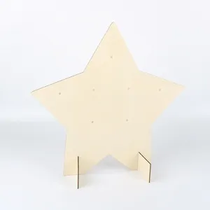Wooden star shaped display stand with support feet and holes for party and event decoration.