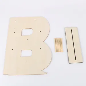 Wooden letter B display stand component detail, showing the wooden panel, sticks, and base plate.