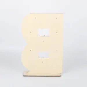 Wooden letter B dessert display stand detail, rustic party wedding cookie holder prop view.