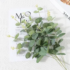 Artificial eucalyptus money leaf branch for wedding floral arrangement and home decor.