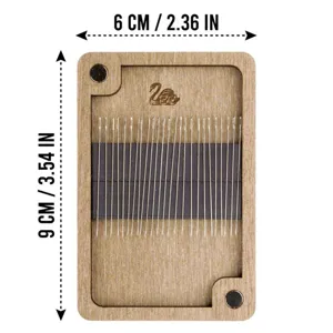 Wooden needle case detail showing magnetic interior and metal sewing needles included.