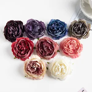 Detailed view of colorful artificial silk peony flower heads for DIY crafts and floral arrangements.