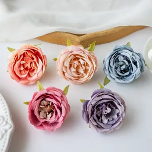 Artificial silk peony flower heads for wedding decoration, DIY crafts, and photo props.