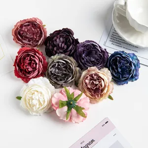 Artificial peony silk flower heads for DIY wedding floral arrangements and home decor crafts.