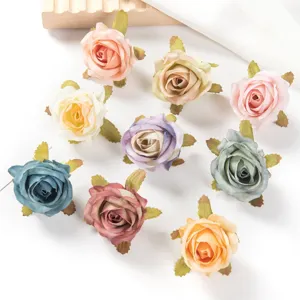 Close-up detail shot of colorful artificial retro rose flower heads for DIY crafts and decor.