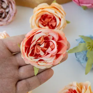Artificial peony rose flower head silk fabric closeup detail for wedding decoration