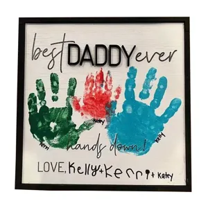 Wooden Father's Day handprint sign with colorful hand prints and custom family names.