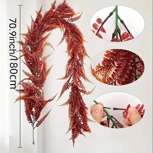 Artificial boston fern hanging vine detail, realistic red autumn foliage for wedding decor.