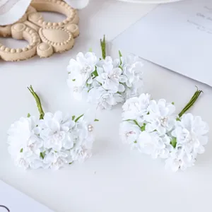 White artificial silk flower bunches for DIY craft, wedding wreaths, and scrapbooking decor.