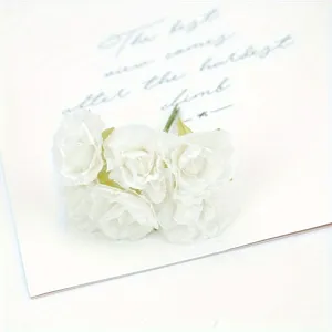 Detailed close-up shot of white artificial peony silk flower heads for decoration.
