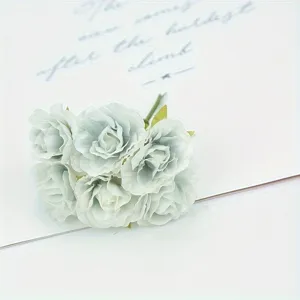 Detailed close-up shot of artificial small peony silk flowers in pale blue, perfect for DIY.