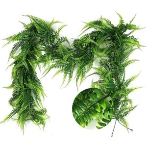 Artificial hanging fern vine green plant detailed view for home decor and wedding backdrop.