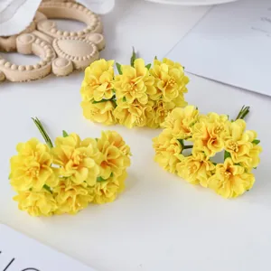 Small yellow artificial silk flowers bouquet detail shot, for DIY wreaths and wedding crafts.